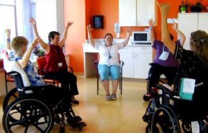 Photo shows a group of staff members and patients participated in creative movement exercise