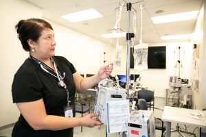 Nurse using smart pump IV pump