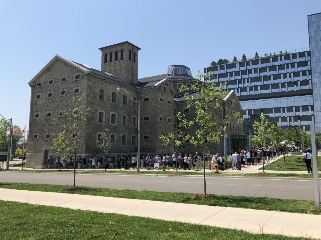 Image of Bridgepoint building with a lineup of people waiting to visit during Doors Open Toronto