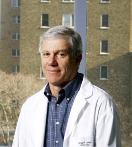 Headshot of Dr. Allan Detsky wearing white labcoat