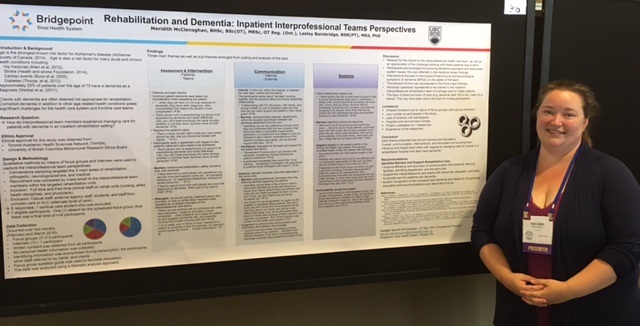 Occupational Therapist with a poster at a conference