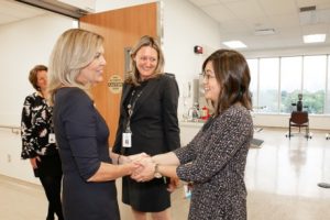 In the hospital at Bridgepoint, a manager shakes hands with Ontario's Minister of Healht and Long Term Care, Christine Elliot